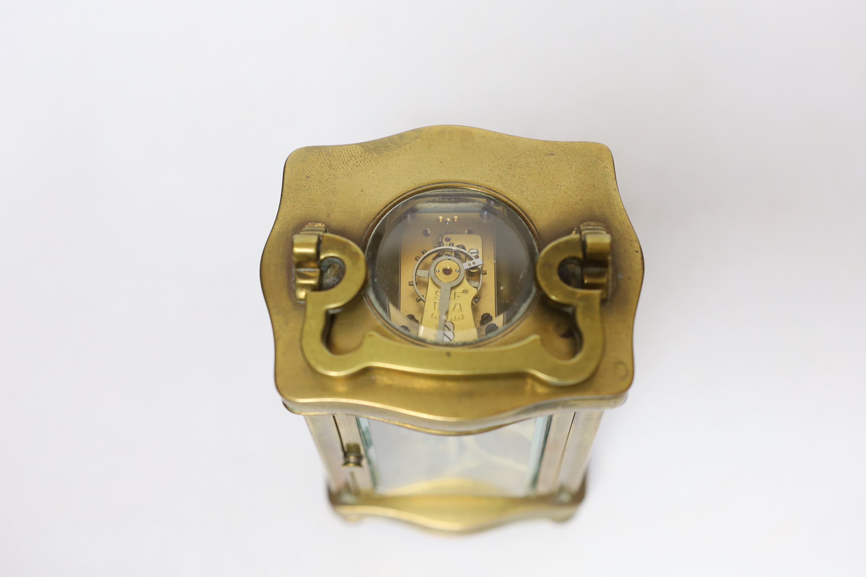 A brass carriage timepiece 12cm high